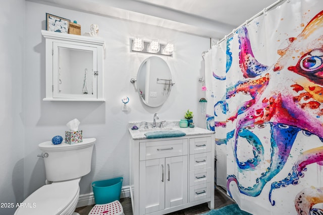 bathroom with vanity, a shower with curtain, and toilet