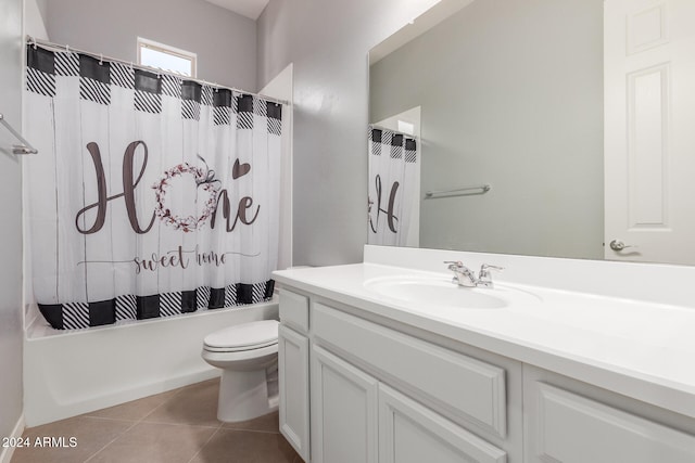 full bathroom featuring vanity, shower / bath combo with shower curtain, tile patterned flooring, and toilet