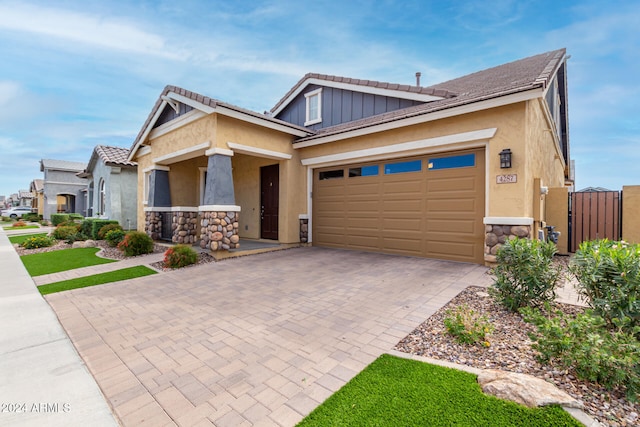 craftsman inspired home with a garage