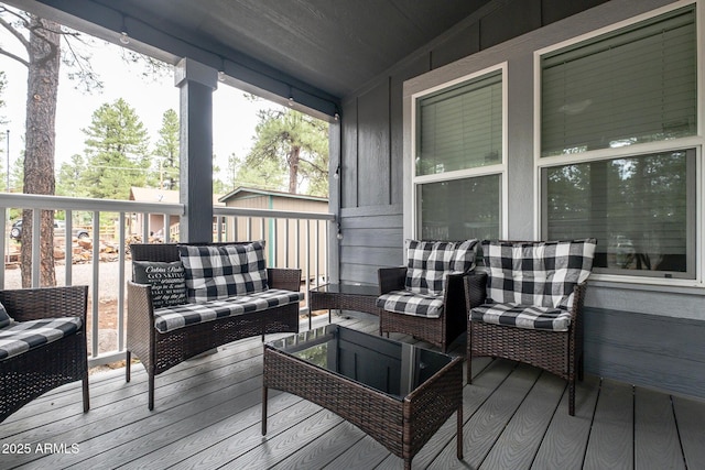 wooden terrace featuring outdoor lounge area