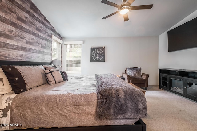 carpeted bedroom featuring ceiling fan and lofted ceiling