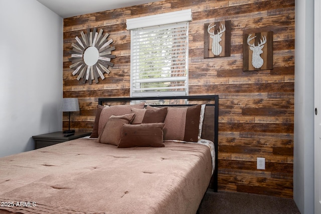 bedroom with wood walls