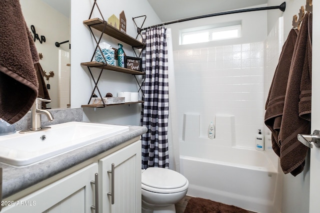 bathroom featuring toilet, vanity, and shower / bath combo