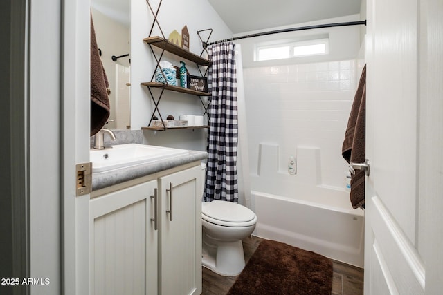 bathroom with toilet, shower / tub combo with curtain, and vanity