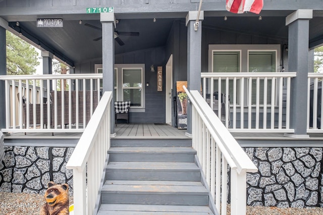 entrance to property with a porch, board and batten siding, and ceiling fan