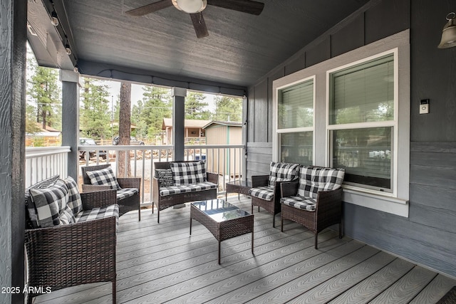 deck with ceiling fan and outdoor lounge area