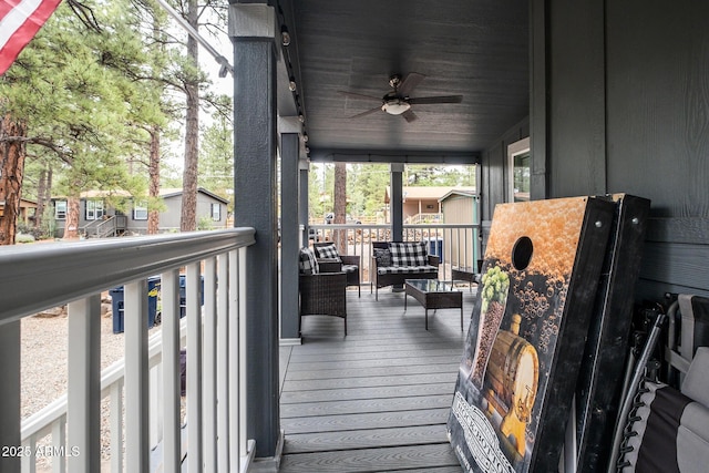 deck featuring an outdoor hangout area and ceiling fan