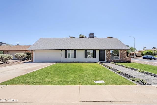 1021 S Almar Cir, Mesa, AZ 85204 - view of front of property featuring concrete driveway, a garage, a front lawn, brick siding, and roof with shingles