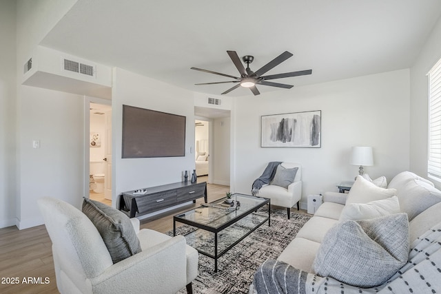 1021 S Almar Cir, Mesa, AZ 85204 - living area featuring a ceiling fan, light wood-type flooring, and baseboards