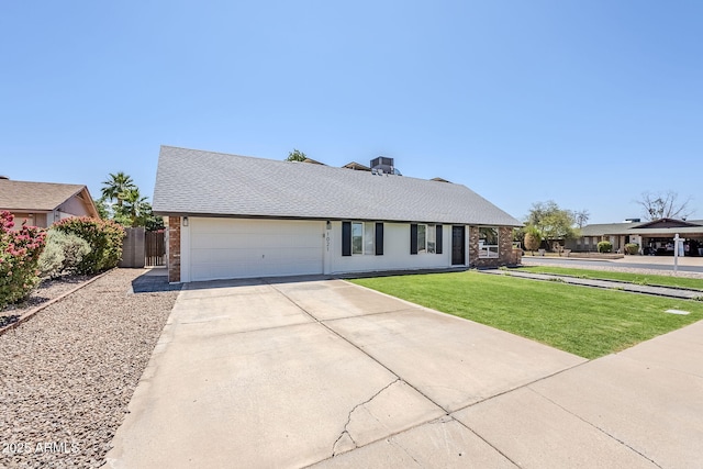 1021 S Almar Cir, Mesa, AZ 85204 - view of front of house with brick siding, driveway, an attached garage, and roof with shingles