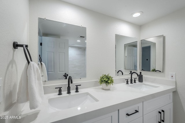 1021 S Almar Cir, Mesa, AZ 85204 - bathroom featuring double vanity and a textured wall