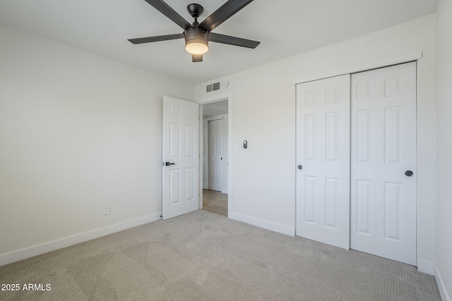 1021 S Almar Cir, Mesa, AZ 85204 - unfurnished bedroom with light colored carpet, baseboards, a closet, and ceiling fan