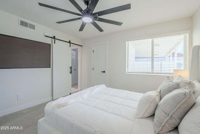 1021 S Almar Cir, Mesa, AZ 85204 - bedroom with a barn door, baseboards, light carpet, and a ceiling fan