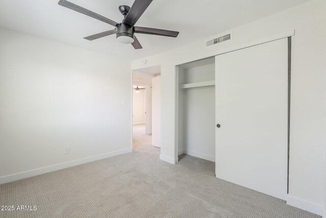 1021 S Almar Cir, Mesa, AZ 85204 - unfurnished bedroom with light colored carpet, a closet, baseboards, and ceiling fan