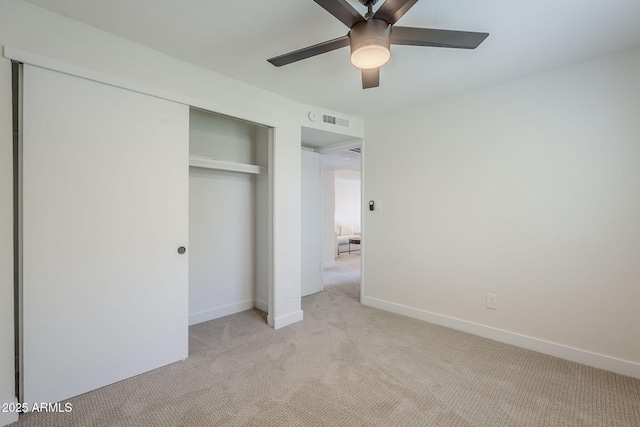 1021 S Almar Cir, Mesa, AZ 85204 - unfurnished bedroom with light colored carpet, a closet, baseboards, and a ceiling fan