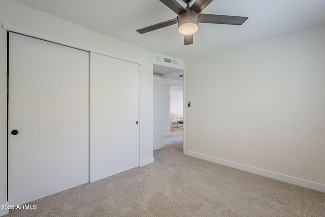 1021 S Almar Cir, Mesa, AZ 85204 - unfurnished bedroom featuring light colored carpet, a closet, baseboards, and ceiling fan