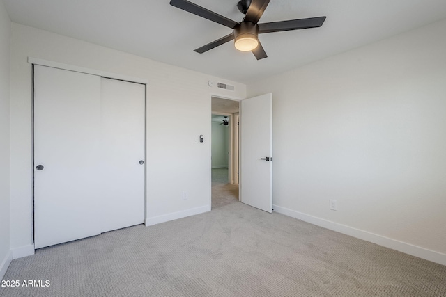 1021 S Almar Cir, Mesa, AZ 85204 - unfurnished bedroom with light carpet, a closet, baseboards, and ceiling fan