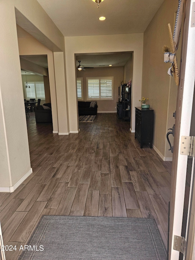 corridor with dark wood-type flooring