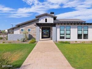 view of front of home featuring a front lawn