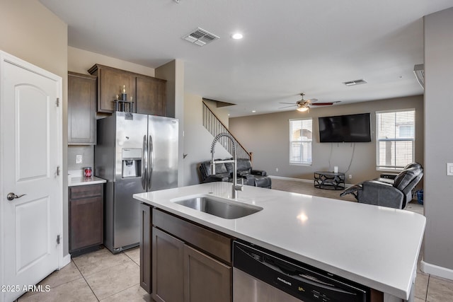 kitchen featuring a sink, visible vents, appliances with stainless steel finishes, and a ceiling fan