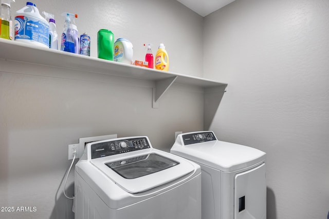 washroom featuring washer and dryer and laundry area