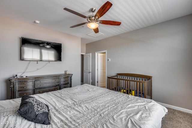 bedroom featuring visible vents, a ceiling fan, baseboards, and carpet floors