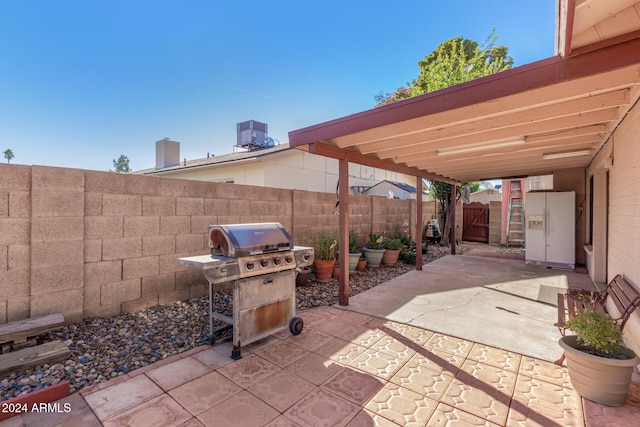 view of patio / terrace featuring area for grilling and cooling unit