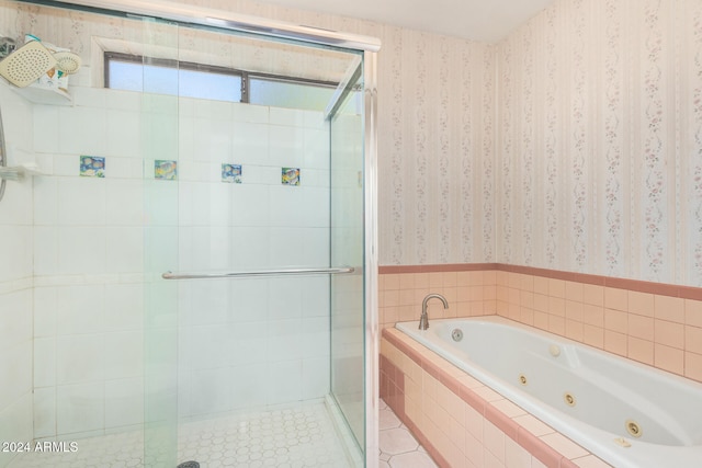 bathroom with shower with separate bathtub