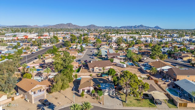 birds eye view of property with a mountain view