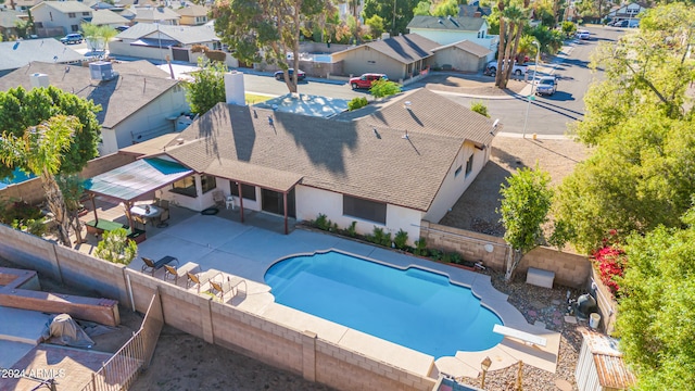 view of pool with a patio area and a diving board