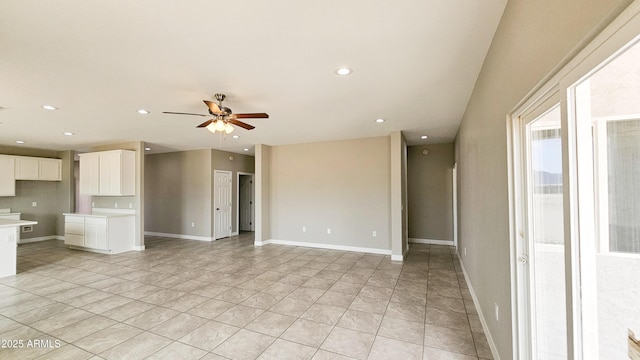 unfurnished living room featuring ceiling fan, recessed lighting, light tile patterned flooring, and baseboards