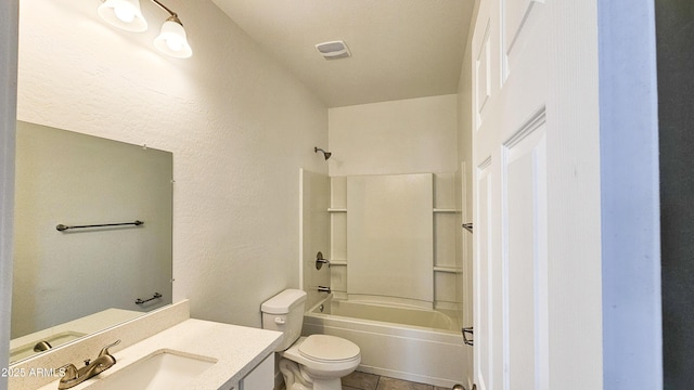 full bathroom with toilet, tile patterned flooring, vanity, washtub / shower combination, and a textured wall