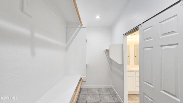 spacious closet featuring light tile patterned flooring