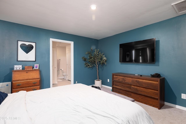 1635 W Cottonwood Bluffs Dr, Benson, AZ 85602 - carpeted bedroom featuring ensuite bath and baseboards