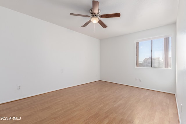 unfurnished room with ceiling fan and light wood finished floors