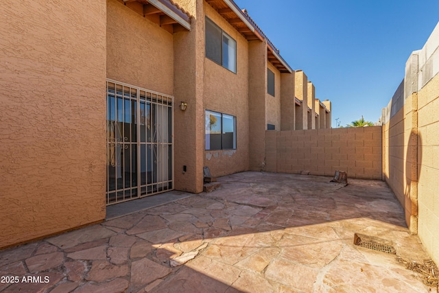 view of patio / terrace featuring fence