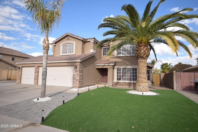 view of front of house featuring a garage and a front yard