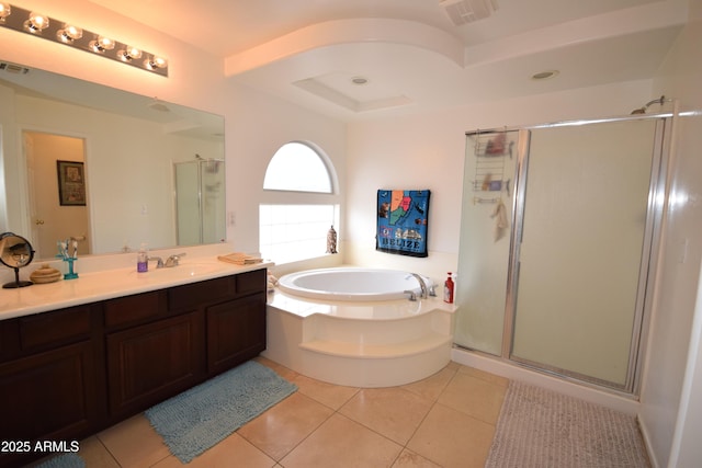 bathroom with tile patterned flooring, vanity, and shower with separate bathtub