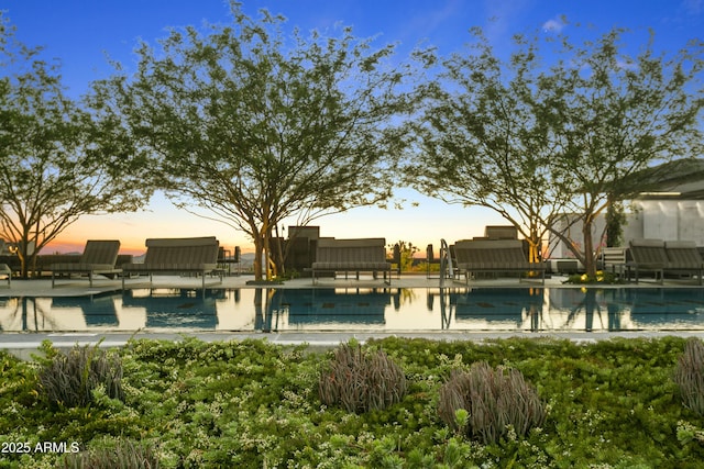 7180 E Kierland Blvd Unit 814, Scottsdale, AZ 85254 - pool at dusk featuring a pool