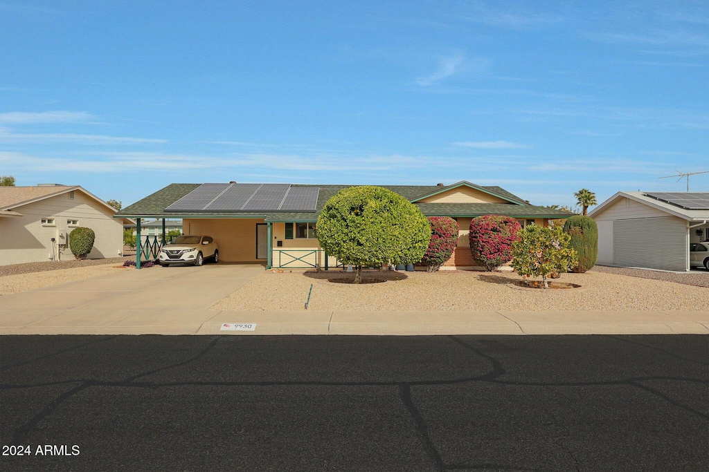 single story home with solar panels