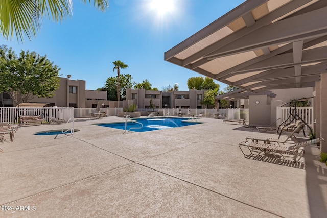 view of swimming pool with a patio