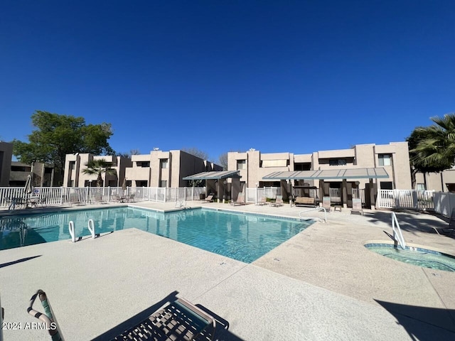 view of swimming pool featuring a patio area