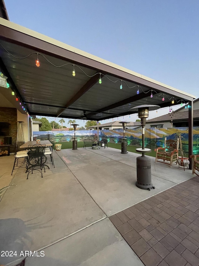 surrounding community with a patio and outdoor dining area