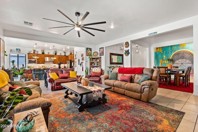 living room with visible vents and light tile patterned flooring