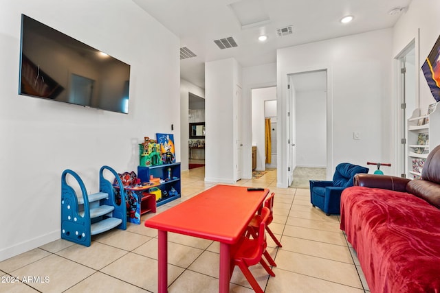 recreation room featuring visible vents, baseboards, and light tile patterned floors