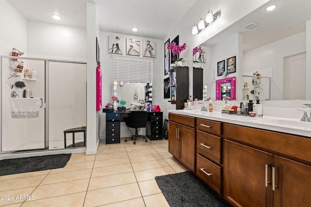 bathroom featuring double vanity, visible vents, a sink, a shower stall, and tile patterned floors