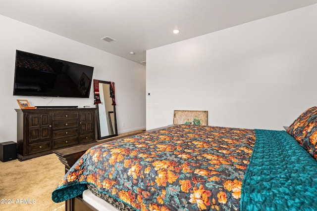 bedroom with carpet flooring, visible vents, and baseboards