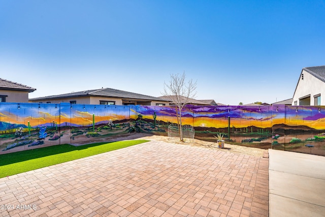 view of patio / terrace featuring fence