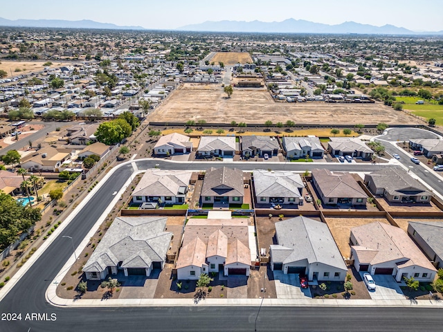 drone / aerial view featuring a mountain view and a residential view