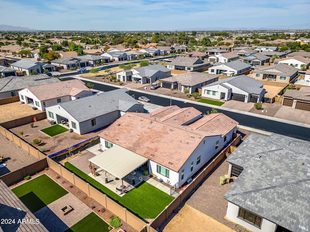 birds eye view of property with a residential view